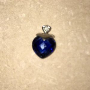 Cushion cut sapphire heart pendant on 10k w gold.